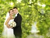 Couple standing under the trees