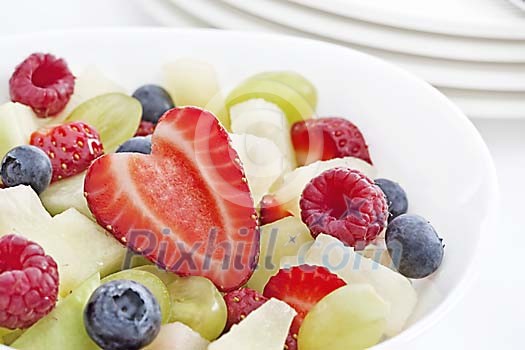 Bowl with different fruits and berries for breakfast Bowl with different fruits and berries for breakfast