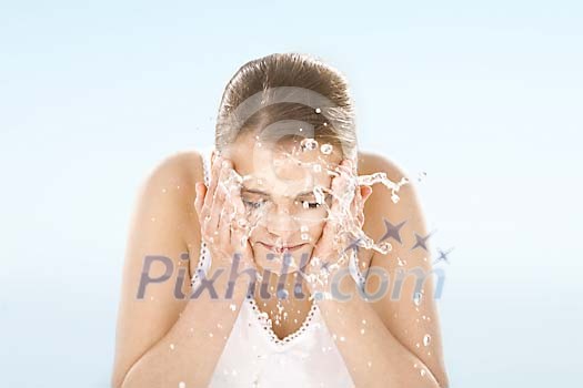 Woman washing her face Woman washing her face