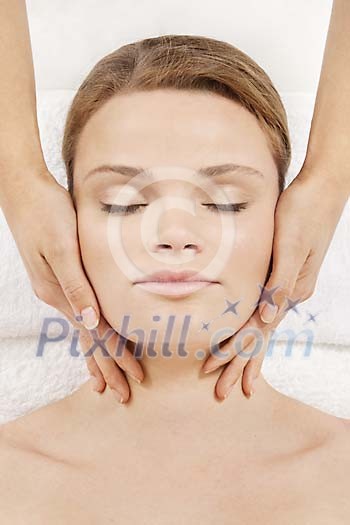 Woman getting a head and face massage Woman getting a head and face massage