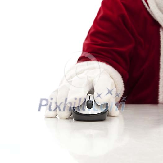 Santas hand with wireless mouse Santas hand with wireless mouse