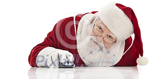 Santa behind table clicking a wireless mouse Santa behind table clicking a wireless mouse