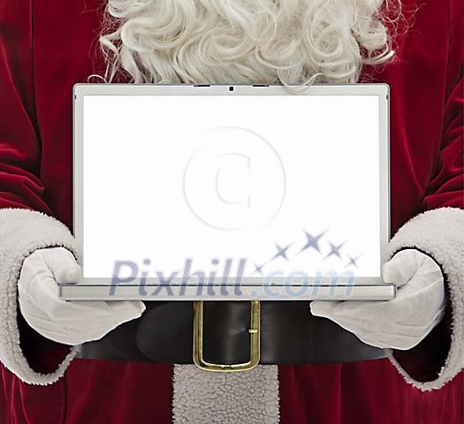 Santa holding a opened laptop in his hands Santa holding a opened laptop in his hands