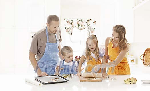 Family making cookies in the kitchen Family making cookies in the kitchen