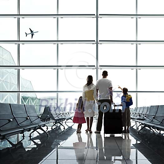 Family at the airport waiting for going to holiday Family at the airport waiting for going to holiday