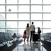 Family at the airport waiting for going to holiday