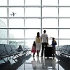 Family at the airport waiting for going to holiday