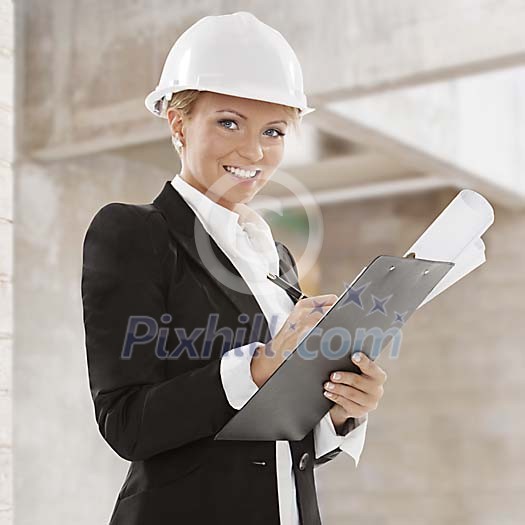Woman inspecting building site Woman inspecting building site
