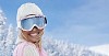 Woman with skiing goggles smiling