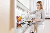 Woman making tea in the kitchen