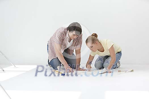 Couple looking at the blueprints Couple looking at the blueprints