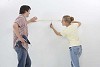 Couple at the wall choosing a place to drill a hole