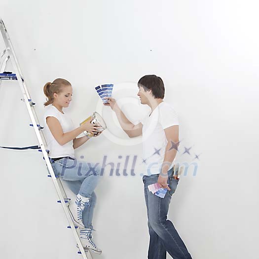 Couple choosing a clour for the wall Couple choosing a clour for the wall
