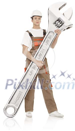 Clipped man standing with oversized wrench Clipped man standing with oversized wrench
