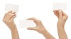 Clipped female hands showing blank businesscards