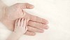 Baby hand on mamas hand