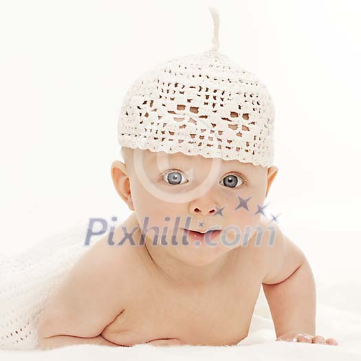 Baby boy with hat looking at the camera Baby boy with hat looking at the camera
