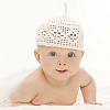 Baby boy with hat looking at the camera