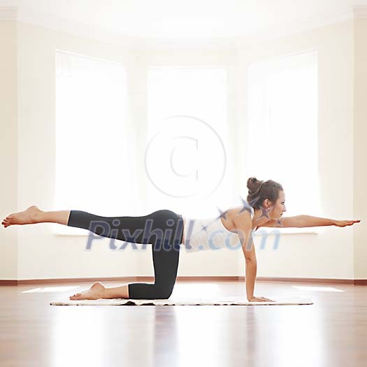 Woman stretching on the floor Woman stretching on the floor