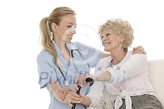 Olderm female with young nurse Olderm female with young nurse