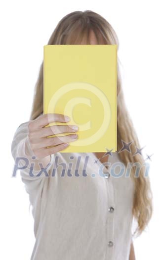 Woman showing a book covering her face Woman showing a book covering her face