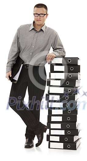 Man leaning on a pile of office folders Man leaning on a pile of office folders