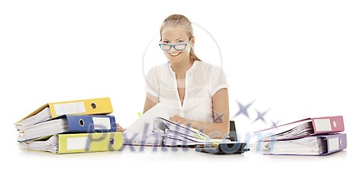 Officeworker surrounded by colourful binders