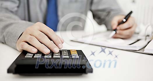 Bookkeeper doing calculations Bookkeeper doing calculations
