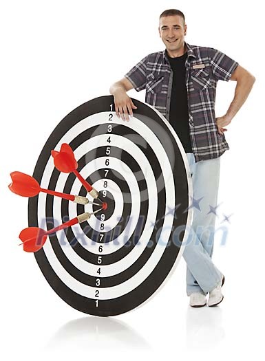Male holding on to dartboard Male holding on to dartboard