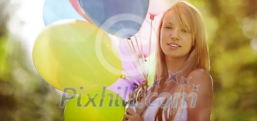 Smiling girl with balloons in hand Smiling girl with balloons in hand