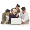 Multicultural group behind laptop