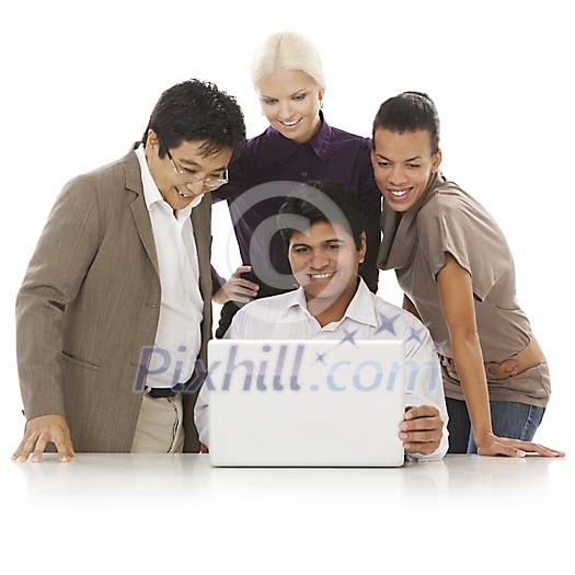 Multicultural group behind laptop Multicultural group behind laptop