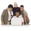 Multicultural group behind laptop