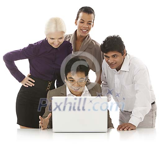 Multicultural group behind laptop Multicultural group behind laptop