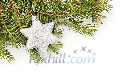 Silver christmas star on fir branch Silver christmas star on fir branch