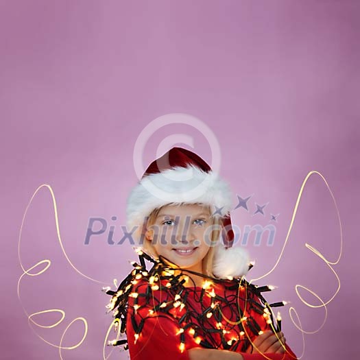 Long exposure of a girl with christmas lights and drawn light wings Long exposure of a girl with christmas lights and drawn light wings