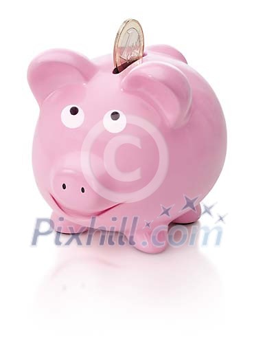 Euro coin going into pink piggybank Euro coin going into pink piggybank