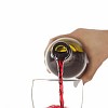 Hand pouring red wine into glass