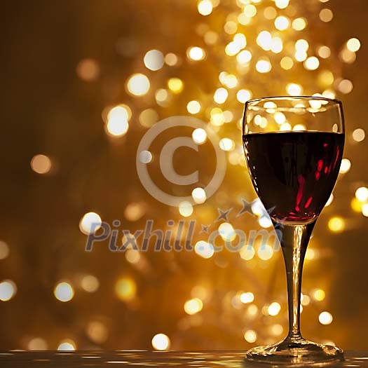 Red wine glass under lights Red wine glass under lights