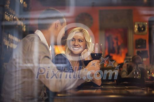 Couple drinking wine at the wine bar Couple drinking wine at the wine bar