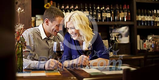 Couple drinking wine at the wine bar Couple drinking wine at the wine bar