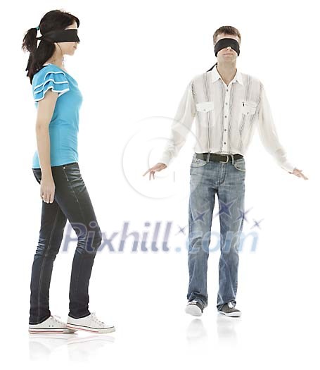 Male and female walking with blindfolds Male and female walking with blindfolds