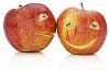 Two apples with eyes and mouths