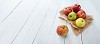 Collection of apples on a wooden background