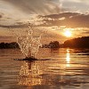 Water splash at sunset in lake