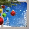 Christmas balls in front of the window