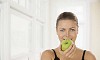 Healthy woman eating an apple