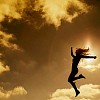 Girl jumping in evening sky