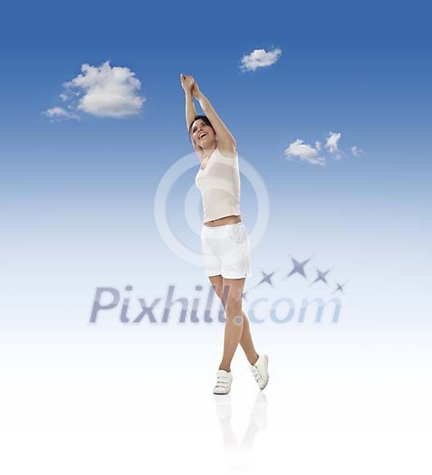 Woman streching on blue sky Woman streching on blue sky