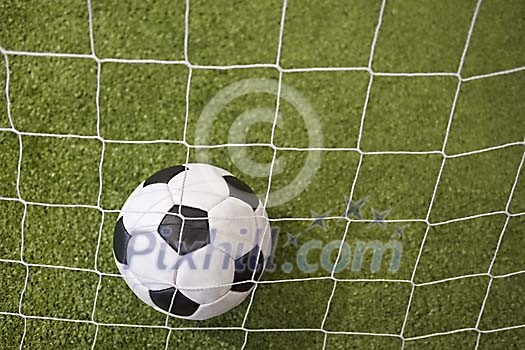 Soccer ball behind the net Soccer ball behind the net